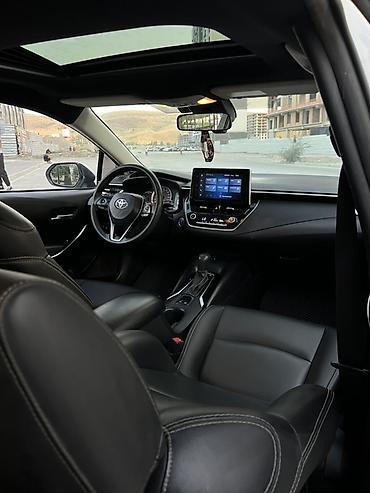 byd e2: Toyota Corolla: 2021 г., 1.8 л, Вариатор, Гибрид, Седан — 9