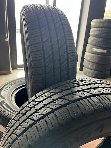 245 65 17: Комплект автомобильных шин Nexen размером 245/65 R17. На фото — 2