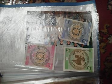 Монеты: Коллекция монет и банкнот России Состав: - Альбом «Памятные монеты — 30