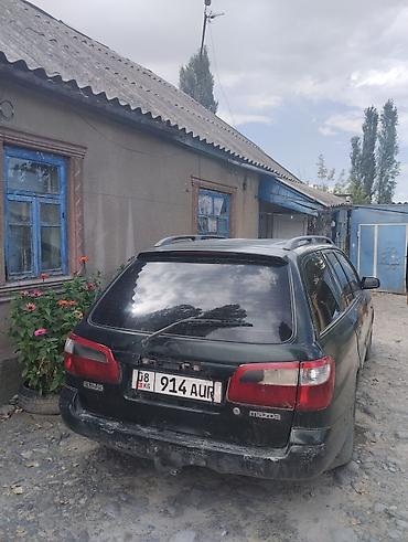 стёк: Mazda 626: 2000 г., 2 л, Механика, Бензин, Универсал — 5