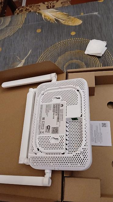 huaweı modem: Huawei optik internet modemi/routeru. Şəkillərdə görünən ağ rəngli — 3