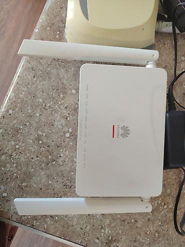 router 2 antenna: İki ədəd Wi‑Fi router/ONU dəsti 1) TP‑Link router - İki xarici — 2
