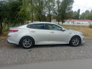 спрей скорая помощь: Kia Optima, серебристый седан бизнес-класса. Кузов и дизайн: -
