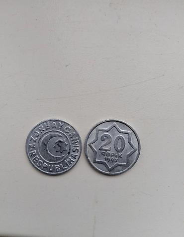 20: Azerbaycan Respublikası 20 qəpik sikkəsi – 1993-cü il buraxılışı. • — 1