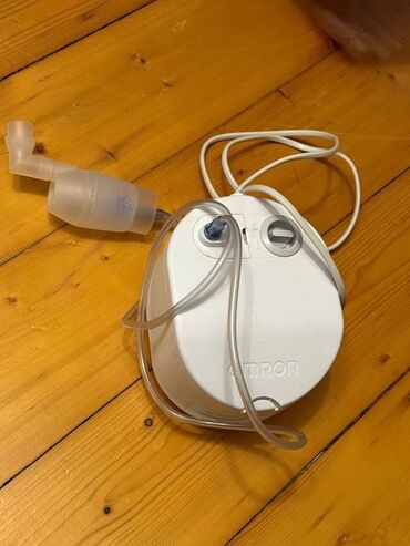 İnqalyatorlar, nebulizerlər: Ağ rəngdə, "OMRON" brendinə məxsus kompressorlu nebulayzer, nəfəs