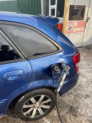 Mazda: Mazda 323: 2000 г., 1.6 л, Автомат, Газ, Хэтчбэк — 9