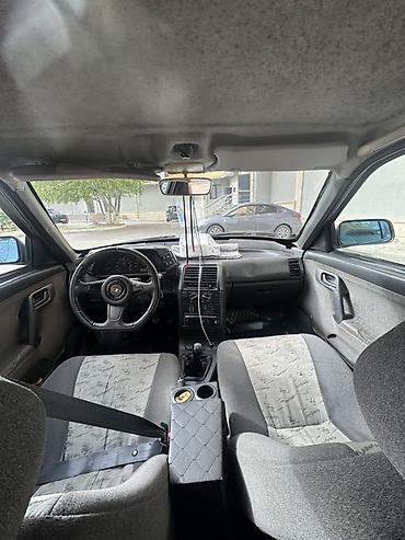 VAZ (LADA): Model: Lada 2112 (hatchback, 5 qapı) Rəng: qara (mat) Yanacaq: benzin — 13