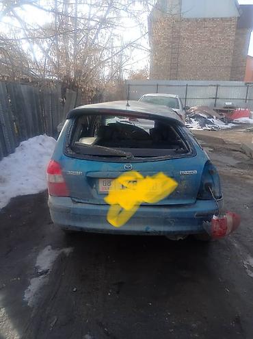 platform ok: Mazda 323F хэтчбек, синего цвета. Автомобиль после сильных — 2