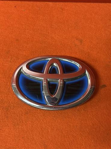 Эмблема Toyota (передняя, синий фон) - Оригинальная передняя эмблема