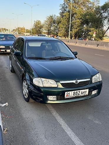 daf 95 480: Mazda 323: 2000 г., 1.6 л, Механика — 2