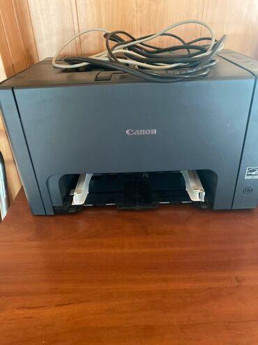 Noutbuk və netbuklar: Canon brendinin qara rəngdə printeri. Bu model effektiv sənəd çapı