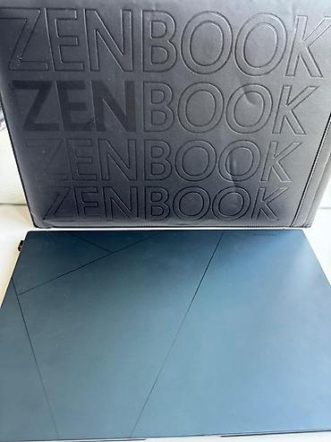 ASUS ZenBook 15 OLED noutbuku Qeyd: Şəkillərdəki stikerlər və loqolar