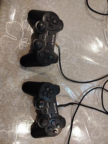 slaqbaum pultlari: Məhsul: 2 ədəd Sony PlayStation 2 (PS2) naqilli oyun pultu — 2