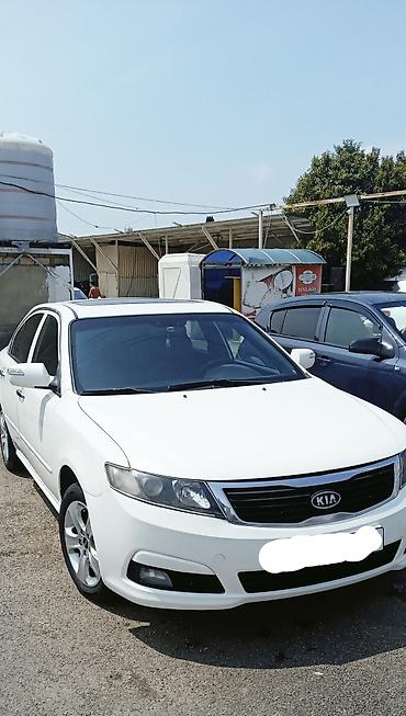optima otracaqlar: Kia Optima sedan – ağ rəng, 4 qapı, ön‑çəkiş. 2008 ci il motor təzə — 3