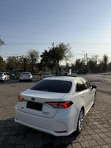 2023 kia ev5: Toyota Corolla: 2020 г., 1.8 л, Вариатор, Гибрид, Седан — 4