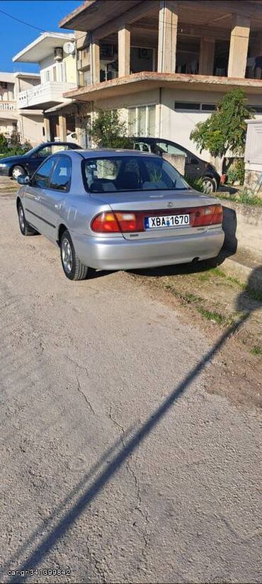 Mazda 323: 1.5 l | 1997 year Coupe/Sports