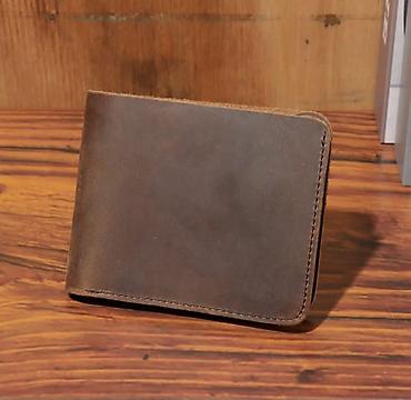 пиджак: Кожаный мужской бумажник (bifold), коричневый. - Материал — 1