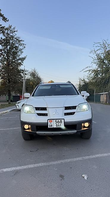 фары на митсубиси: Mitsubishi Airtrek: 2004 г., 2.4 л, Автомат, Газ, Кроссовер — 1