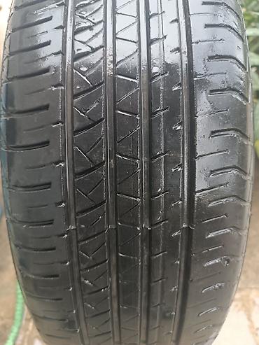 diski teker type 1: 225/60 R18 ölçüdə avtomobil şinləri. Şinlərin üzərində M+S işarəsi — 2