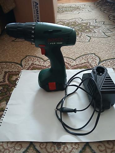 alat za oluke: Bosch PSR 1200 bežična bušilica/odvijač sa punjačem i baterijom. - — 2