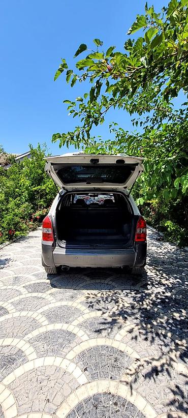 qabaq şüşə: Hyundai Tucson: 4.4 l | 2009 il Krossover — 2