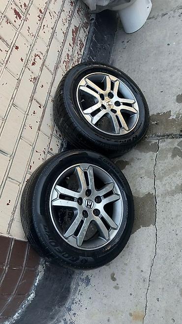 tir: Пара колес в сборе для Honda. - Диски: оригинальные легкосплавные — 4