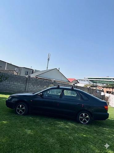 byd e6: Toyota Carina E: 1998 г., 1.6 л, Механика, Бензин, Хэтчбэк — 7
