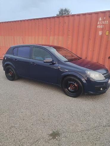 opel astra satışı: Opel Astra hetçbek avtomobil. Tünd göy rəngdə kuzova malikdir. 5 — 1
