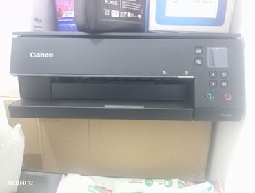 Принтеры: Canon brendinə məxsus bu Pixma printer, qara rəngdə və yığcam dizayna