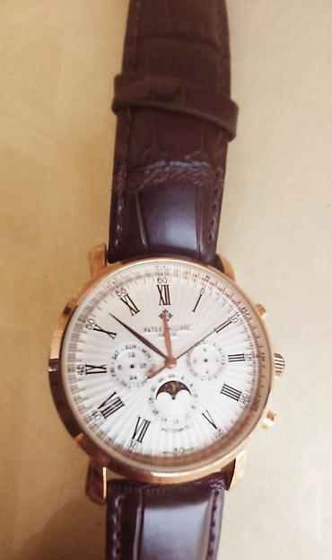 Qol saatları: Patek Philippe kişi qol saatı. Mexanizm: avtomatik (öz-özünə quran) — 2
