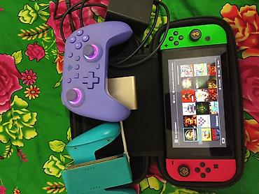 Nintendo Switch: Прошитый Нинтендо свич, есть недастатка маленькая царапина, левый — 1