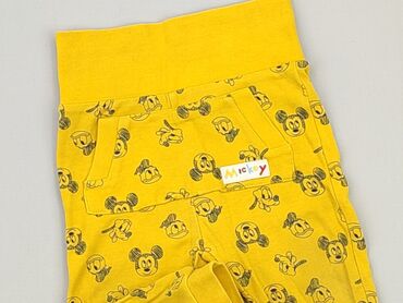 kapcie żółte: Spodnie dresowe, Cool Club, 6-9 m, stan - Bardzo dobry
