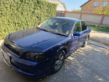 Другой тюнинг: Седан темно-синего цвета с аэродинамическим обвесом и заниженным — 1