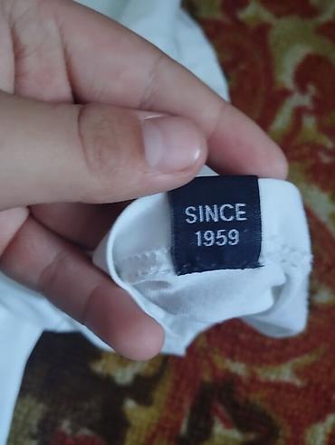 Футболки: Футболка Ellesse, белая, с крупным фирменным логотипом на груди — 9