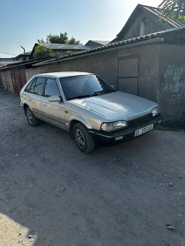 чехол с боковой: Mazda 323: 1989 г., 1.6 л, Механика, Бензин, Хетчбек