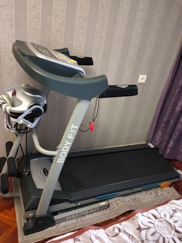 kişi üçün idman çəkmələri: Qaçiş aparatı 650azn. Az işlənib, 120 kg.kimi çəki goturur. Ünvan