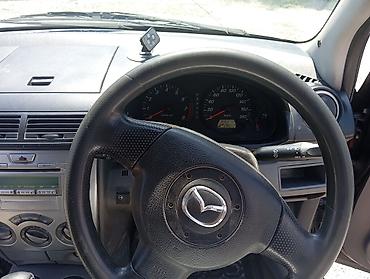 коврик: Mazda Demio: 2005 г., Автомат, Бензин, Хэтчбэк — 1