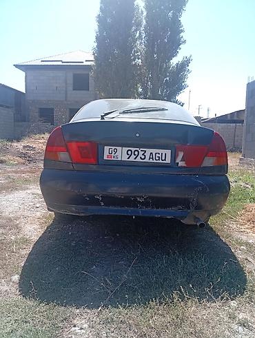 руль windom: Mitsubishi Carisma: 1999 г., Седан — 8