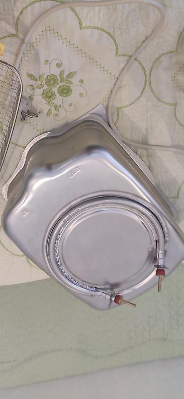 Mətbəx texnikası: Tefal fi̇rmasi̇ni̇ni̇ frutur bi̇si̇rən ci̇hazi̇. İci̇ndə toyuq — 5