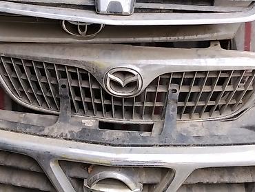 Передняя решётка радиатора Mazda с фирменным логотипом. Описание: - at lalafo.kg Передняя решётка радиатора Mazda с фирменным логотипом. Описание: -