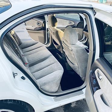 diska 13: Nissan Sunny: 2002 г., Автомат, Бензин, Седан — 5