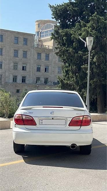 Nissan: Nissan Maxima QX sedan – ağ rəng, 4 qapı, qabaqdan ötürücülü. Əsas — 3