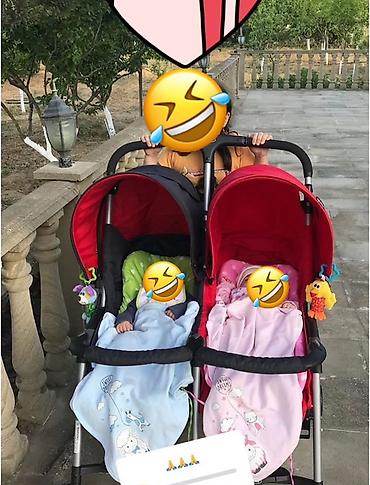 əkizlər ucun: Əkiz uşaqlar üçün ikili uşaq arabası. Yari qara yari qirmizidir.ekiz — 1