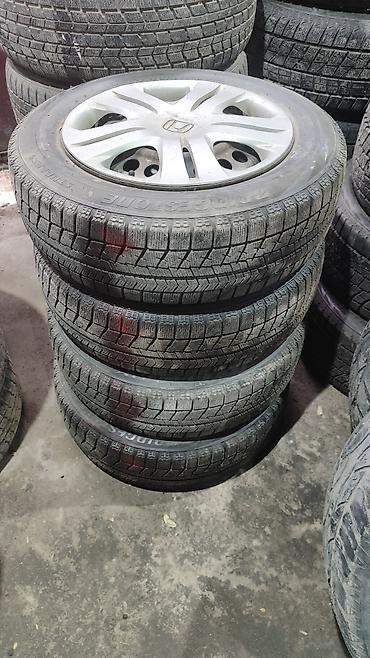 952 2: 175/65r15 с дисками штамповки и колпаки 4*100 фит. Бриджстоун — 1