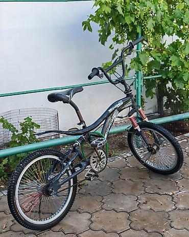 BMX-велосипед с двойной подвеской. Основные характеристики: - Тип