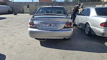 duman fara: Mitsubishi Lancer: 1.6 l | 2006 il 466000 km Sedan — 4