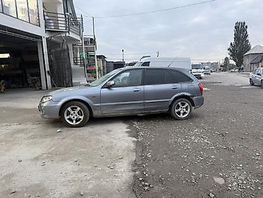 Mazda 323: 2003 г., 1.5 л, Механика, Бензин, Универсал