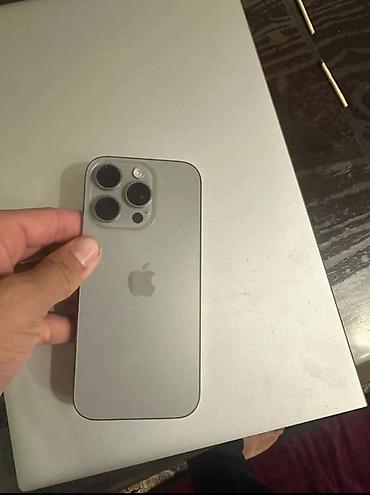 Смартфон Apple iPhone (серия Pro) в цвете «натуральный титан/серый»