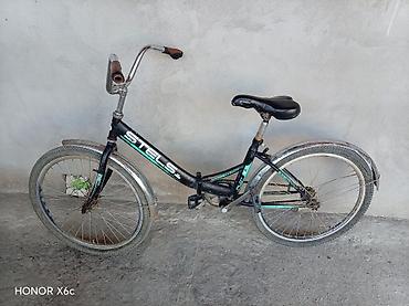 velosipedlər isma: STELS Pilot 24 şəhər/komfort tipli velosiped.Nasosda üstündə verilir — 6