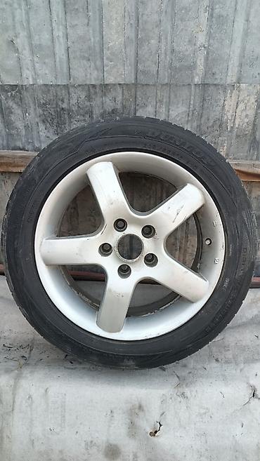 Литой диск с шиной Dunlop. Характеристики: - Диаметр диска